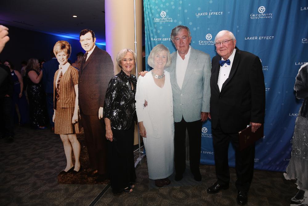 Don and Nancy Lubbers pose with their cardboard cutouts at Enrichment Dinner